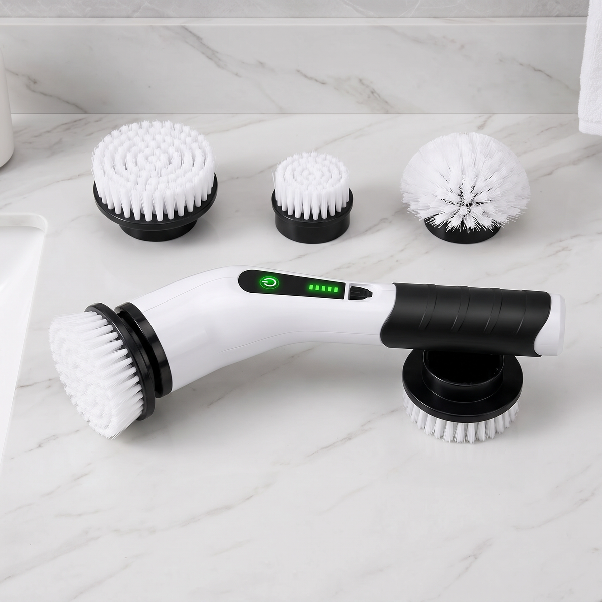 Electric spin scrubber flat-lay with its interchangeable brush heads
