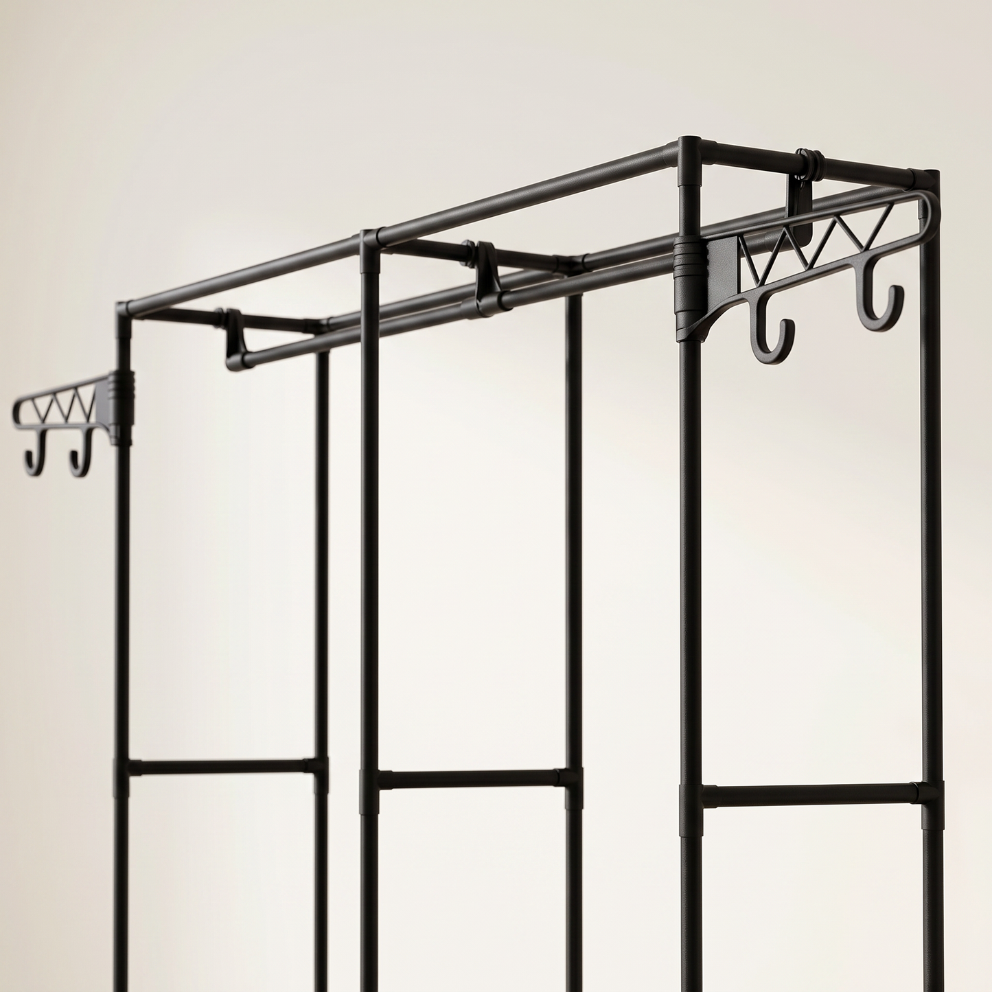 Close-up of the black garment rack's rods and top side hooks